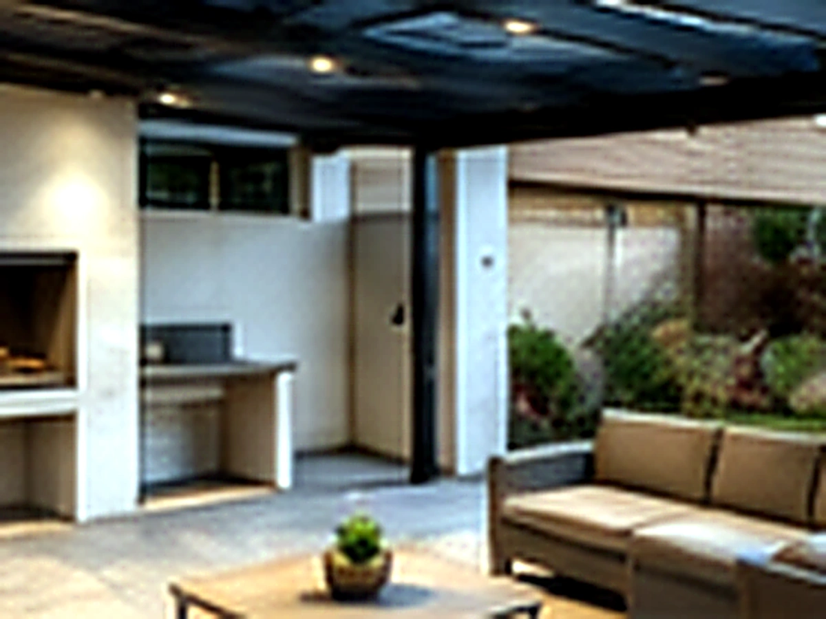 Completed outdoor entertainment area with pergola and built-in braai