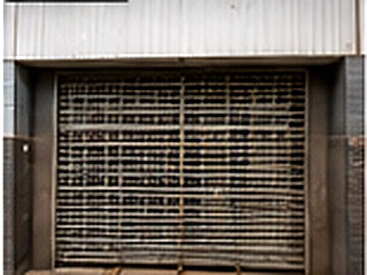 Existing manual roller shutter before retail shopfront upgrade